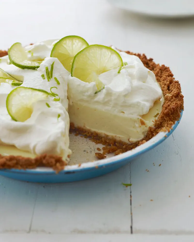 Key lime pie with slice missing from once upon a chef