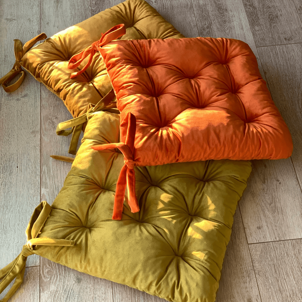 dining chair cushions in yellow, orange, and green