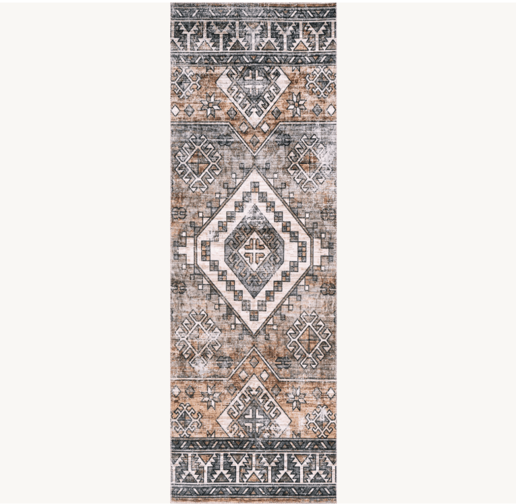 Geometric area rug in a runner size with teal white and copper